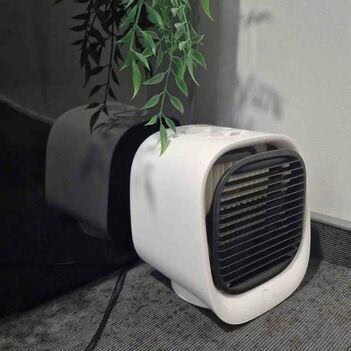 Liam relaxing at home with the AiraBreeze portable air cooler