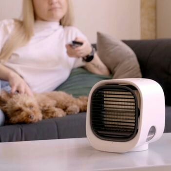 Rachel enjoying quiet, energy-efficient cooling with the AiraBreeze air cooler